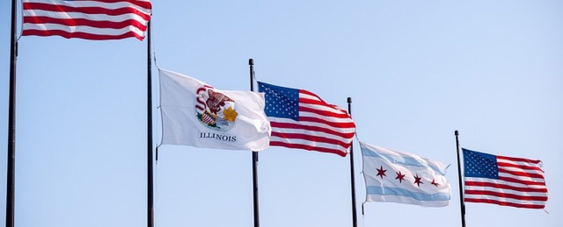 Image containing the United States flag, Illinois state flag, and city of Chicago flag.